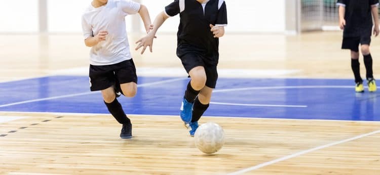 Ball control on a futsal court.